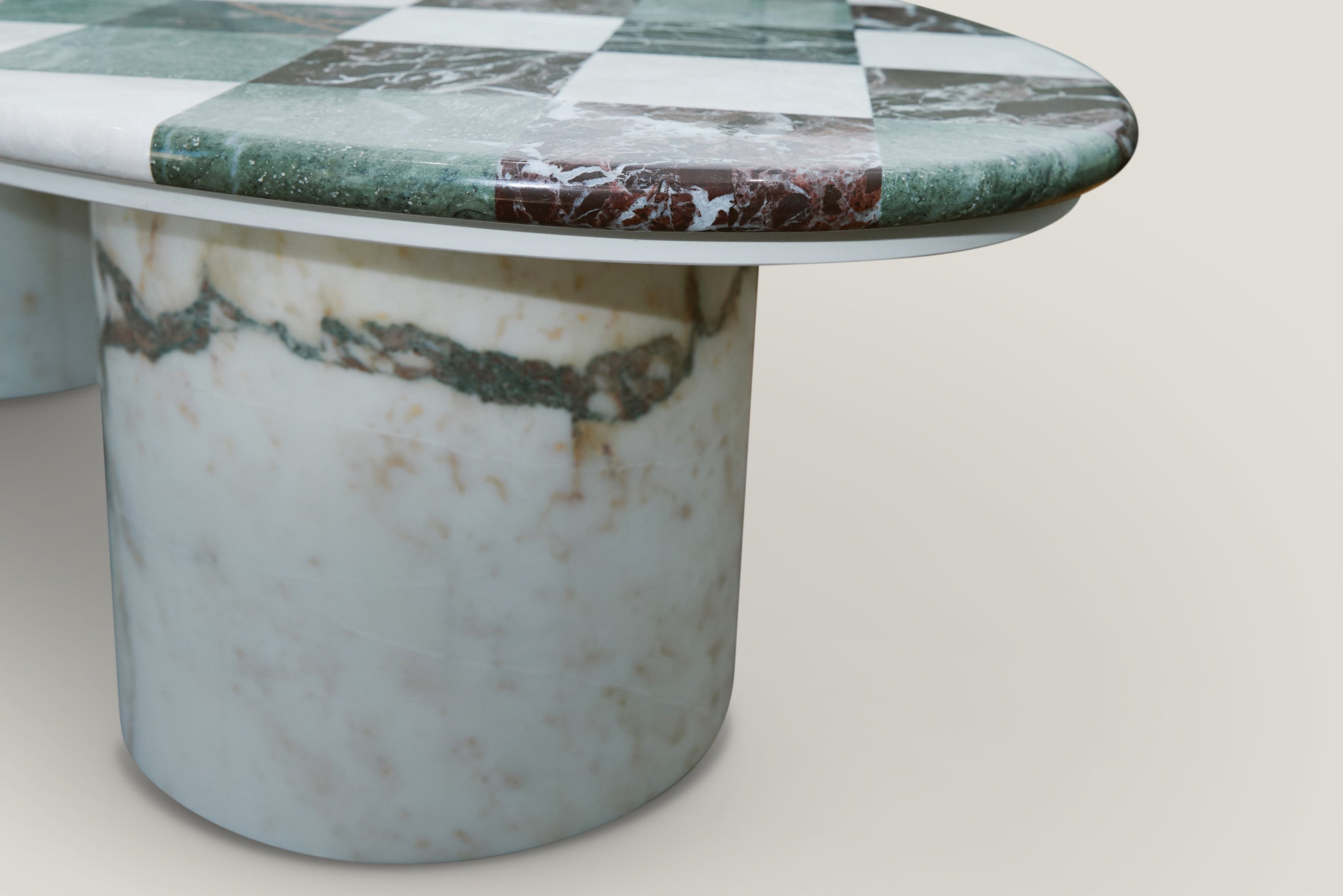 Marble-patterned table with a checkered top on a light gray background
