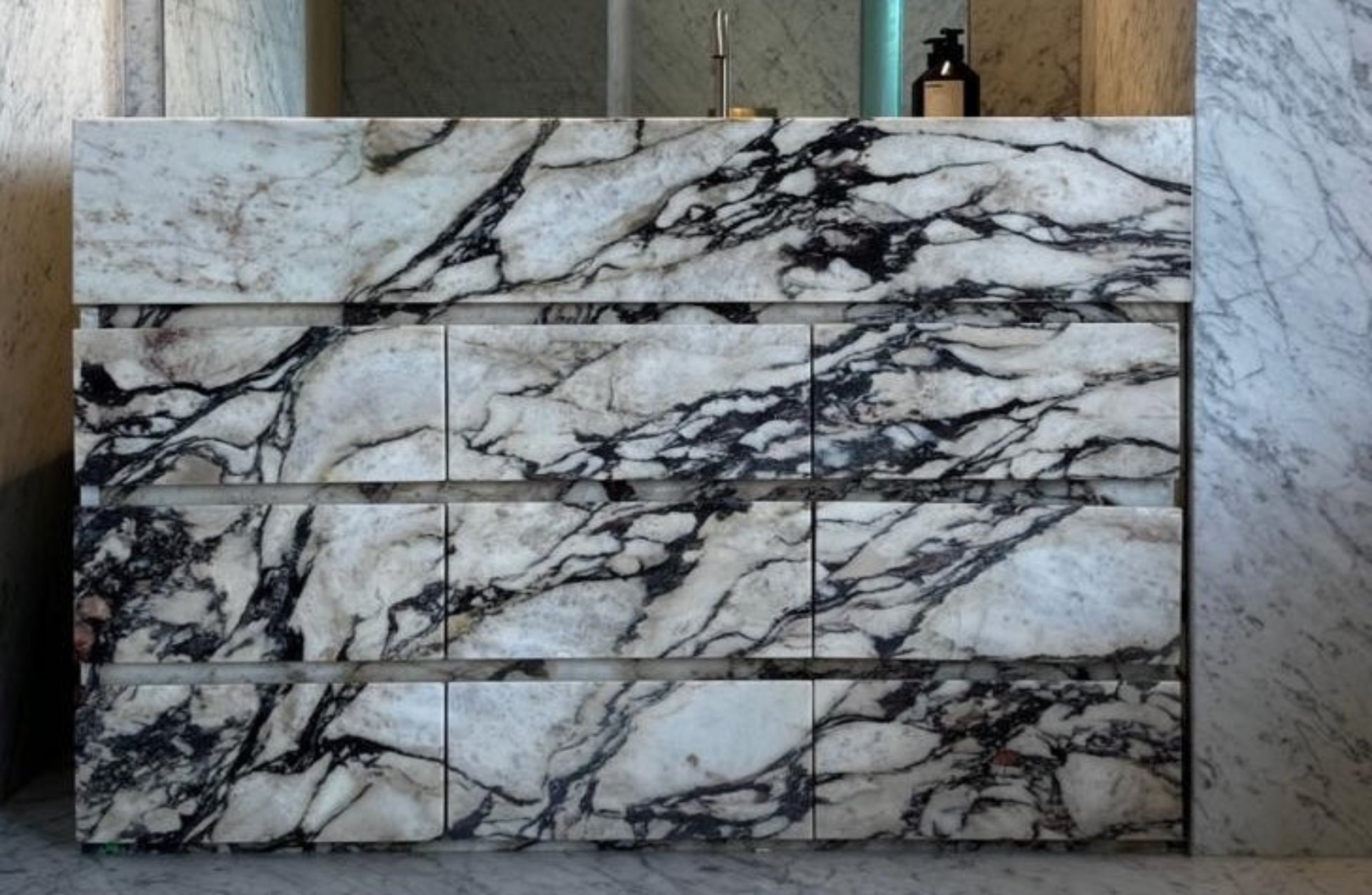 Marble-patterned wall art in a room with marble walls.